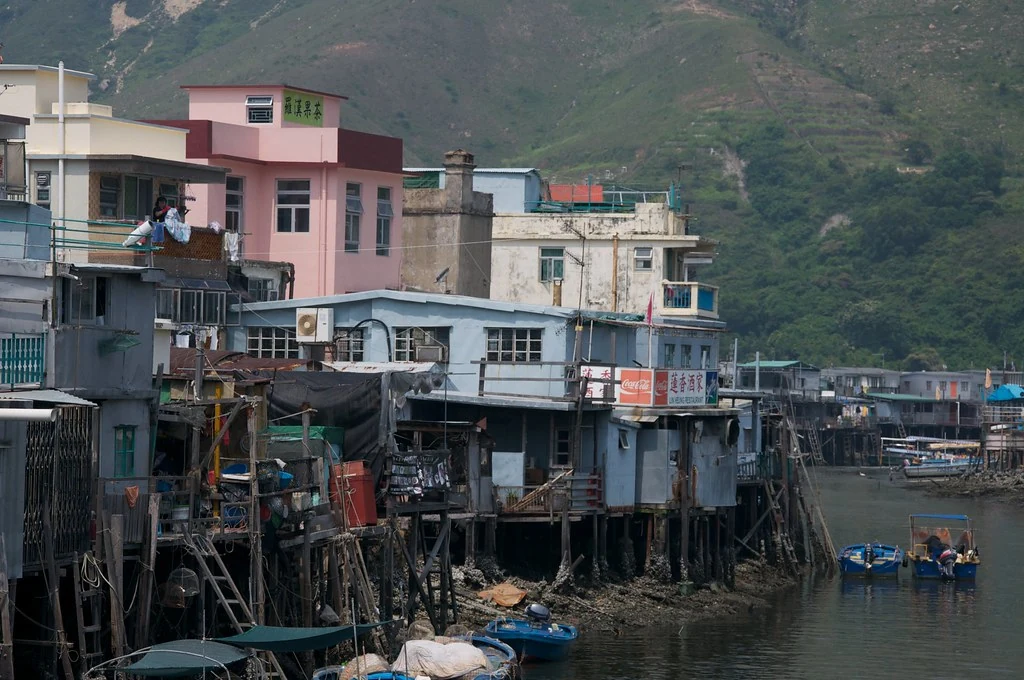 Stilt houses and small boats along a waterway in Tai O.