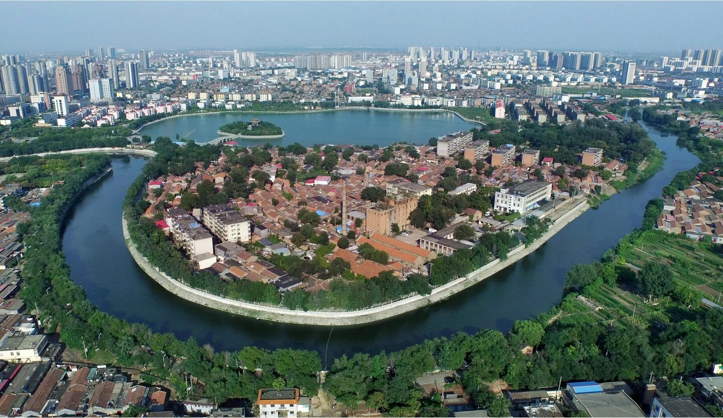 Aerial view of a bend in the Grand Canal around an old urban district in Cangzhou.