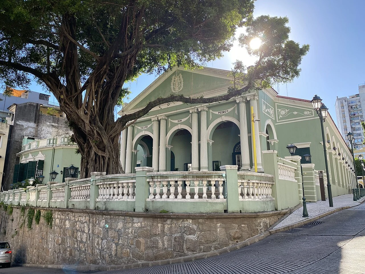 The green exterior and classical entrance of Dom Pedro V Theatre.