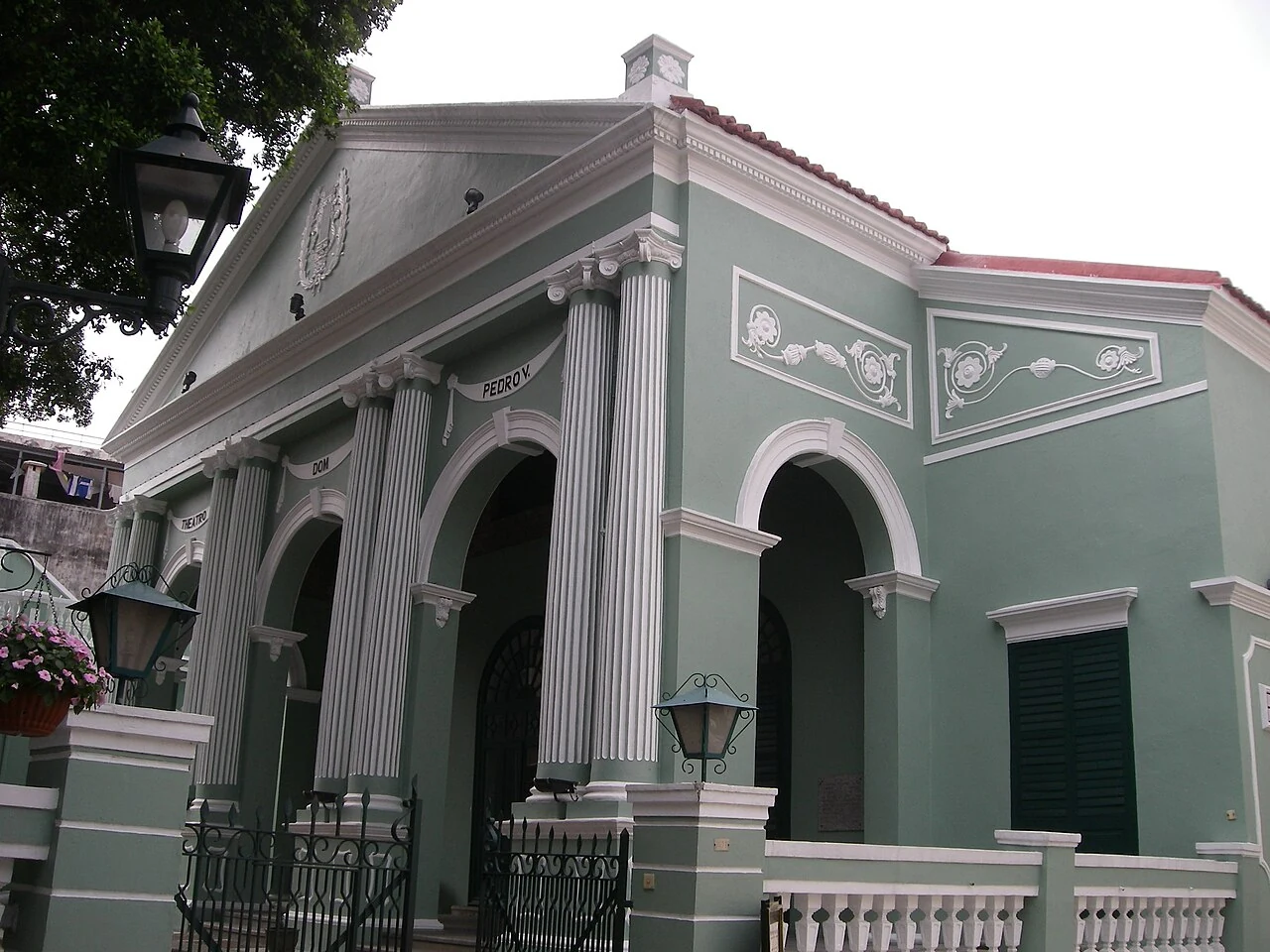 The green exterior and classical entrance of Dom Pedro V Theatre.