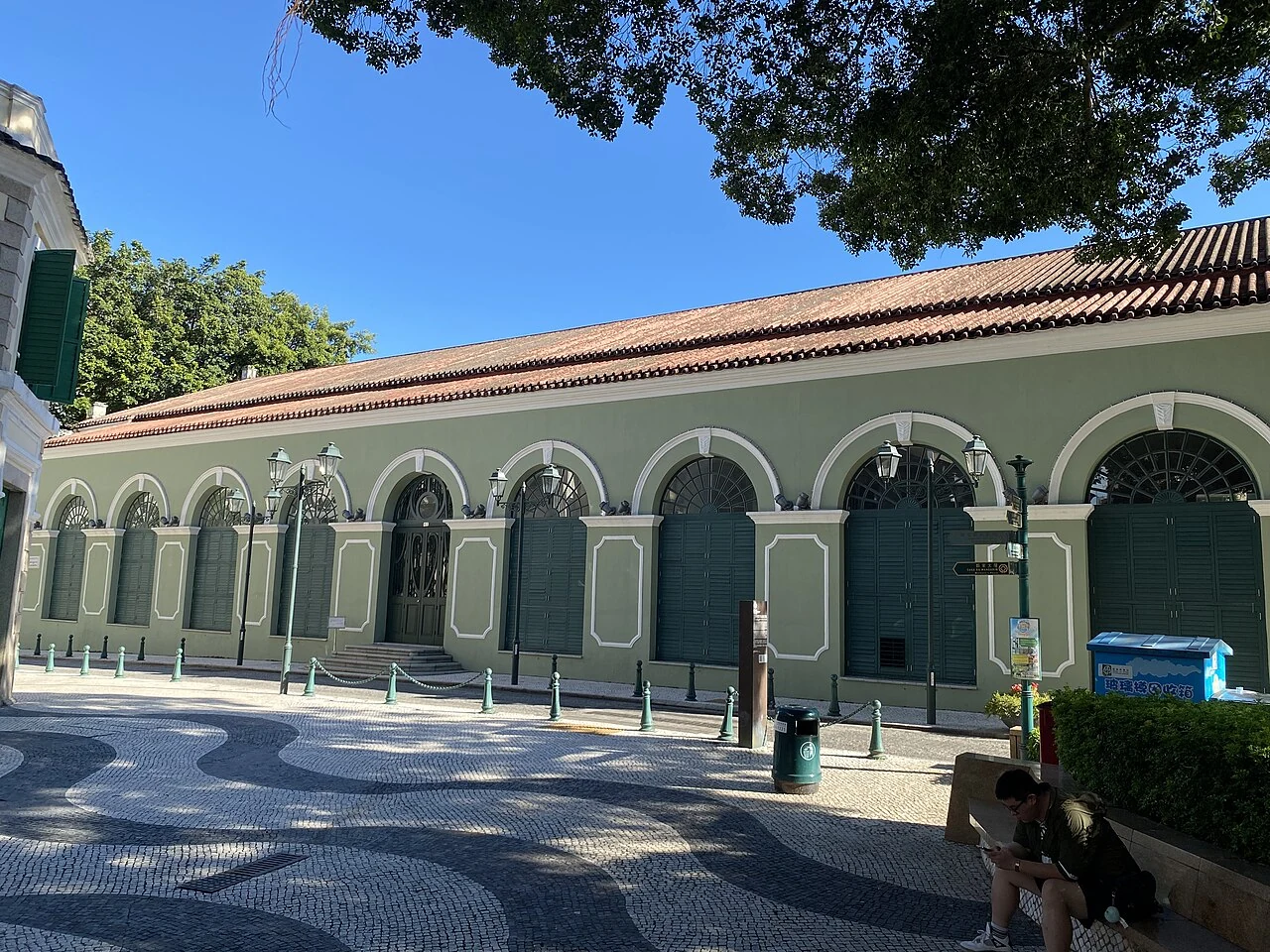 The green exterior and classical entrance of Dom Pedro V Theatre.