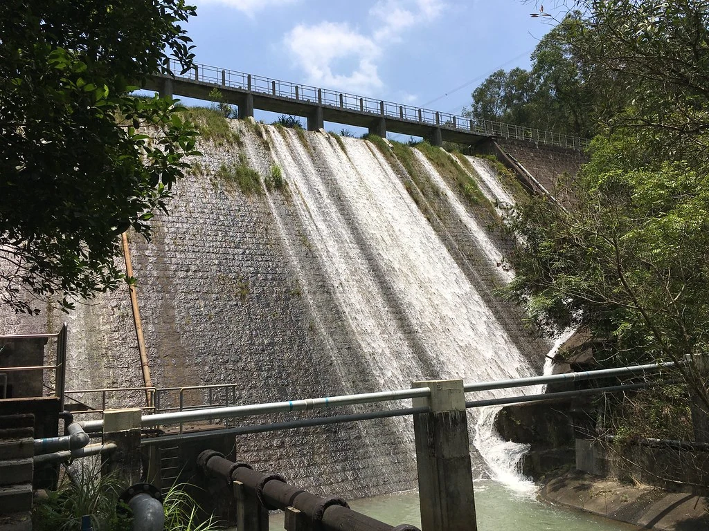 Water spills down the dam at Lam Tei Reservoir.