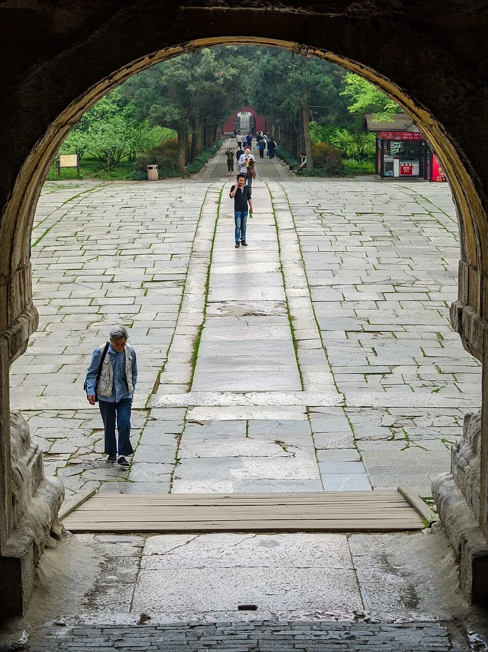 An arched doorway frames the long stone staircase at the Sun Yat-sen Mausoleum.