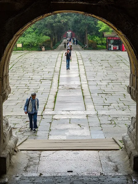 An arched doorway frames the long stone staircase at the Sun Yat-sen Mausoleum.
