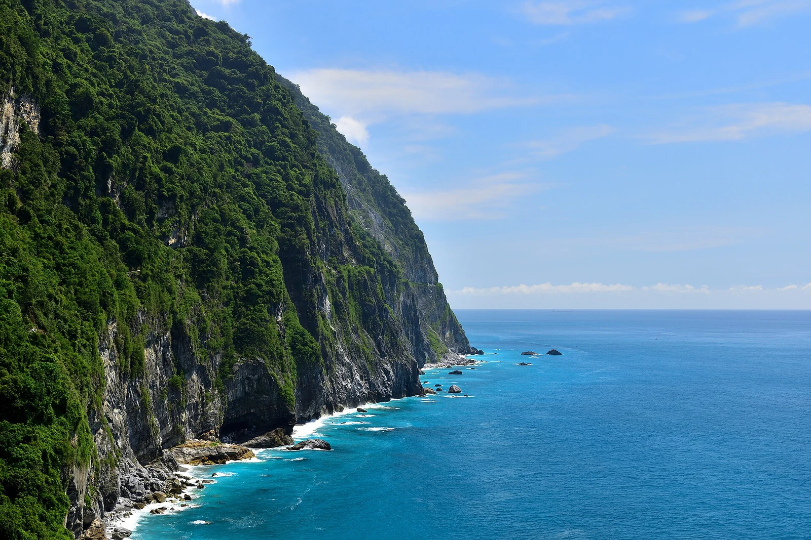 Green cliff above the water