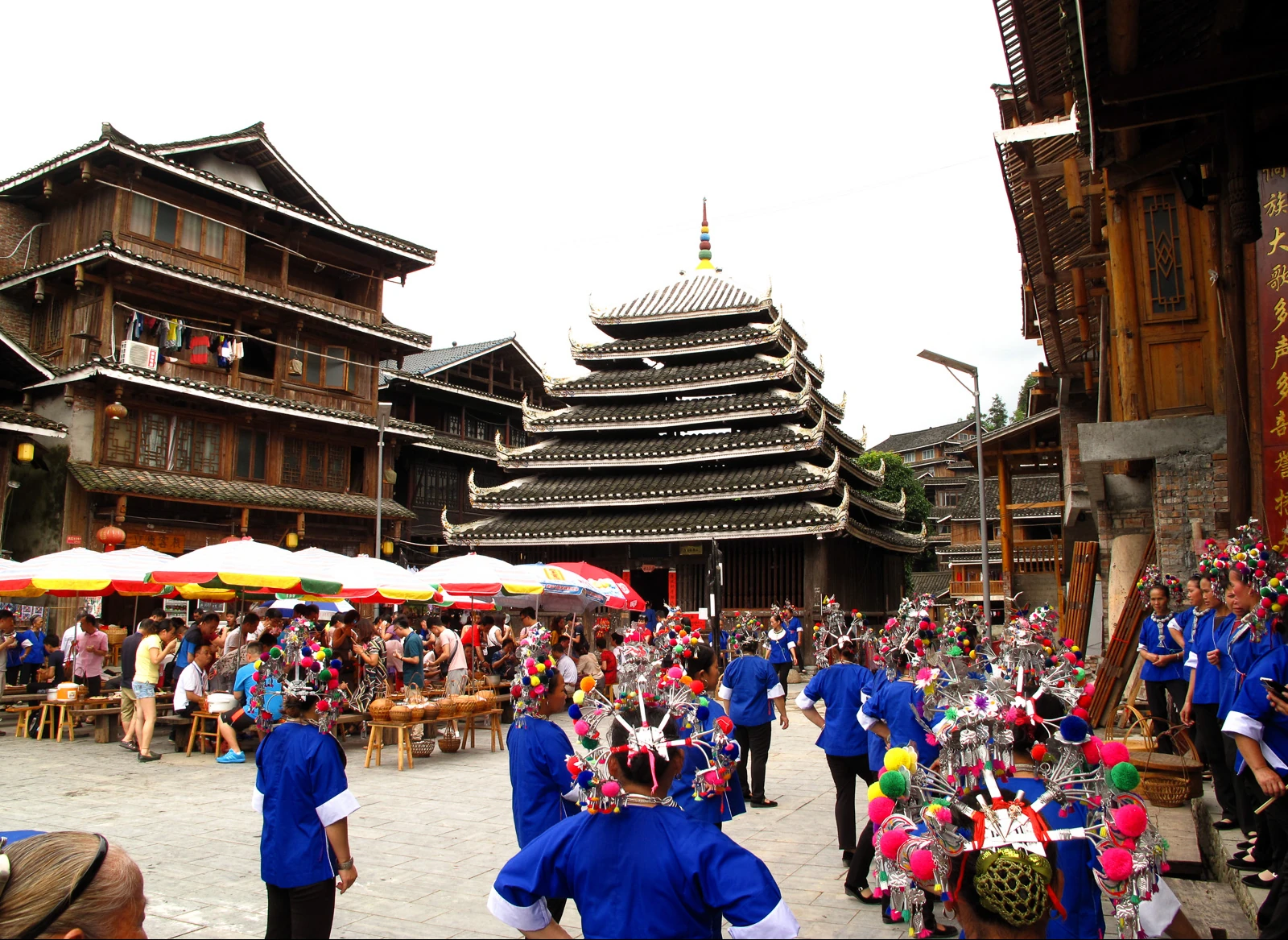 People gather in a courtyard beside Chengyang’s tiered drum tower.
