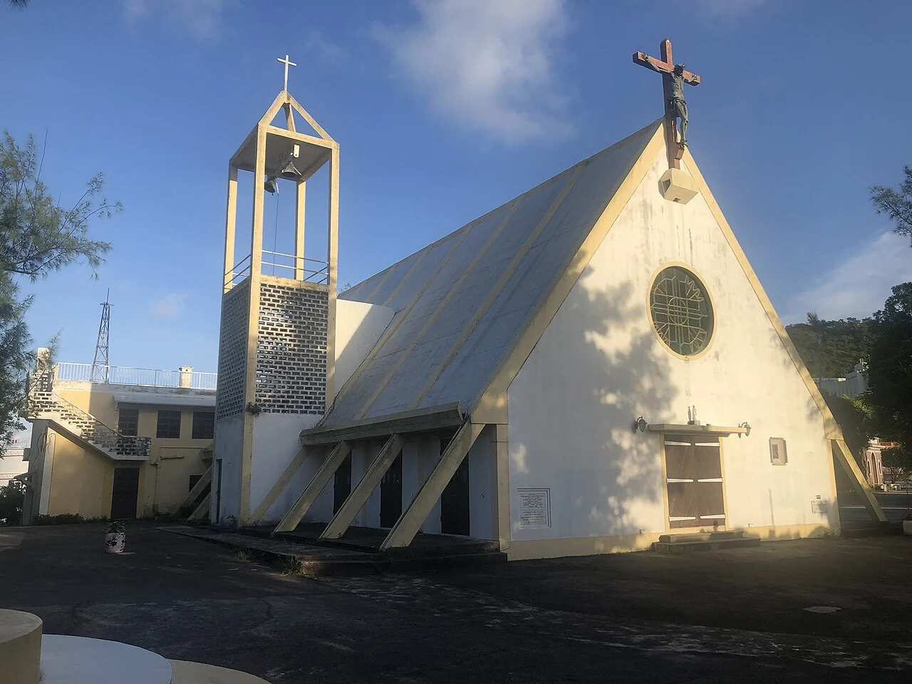 The modern Our Lady of Sorrows Chapel at Ká Hó, with its angled roof and bell tower.